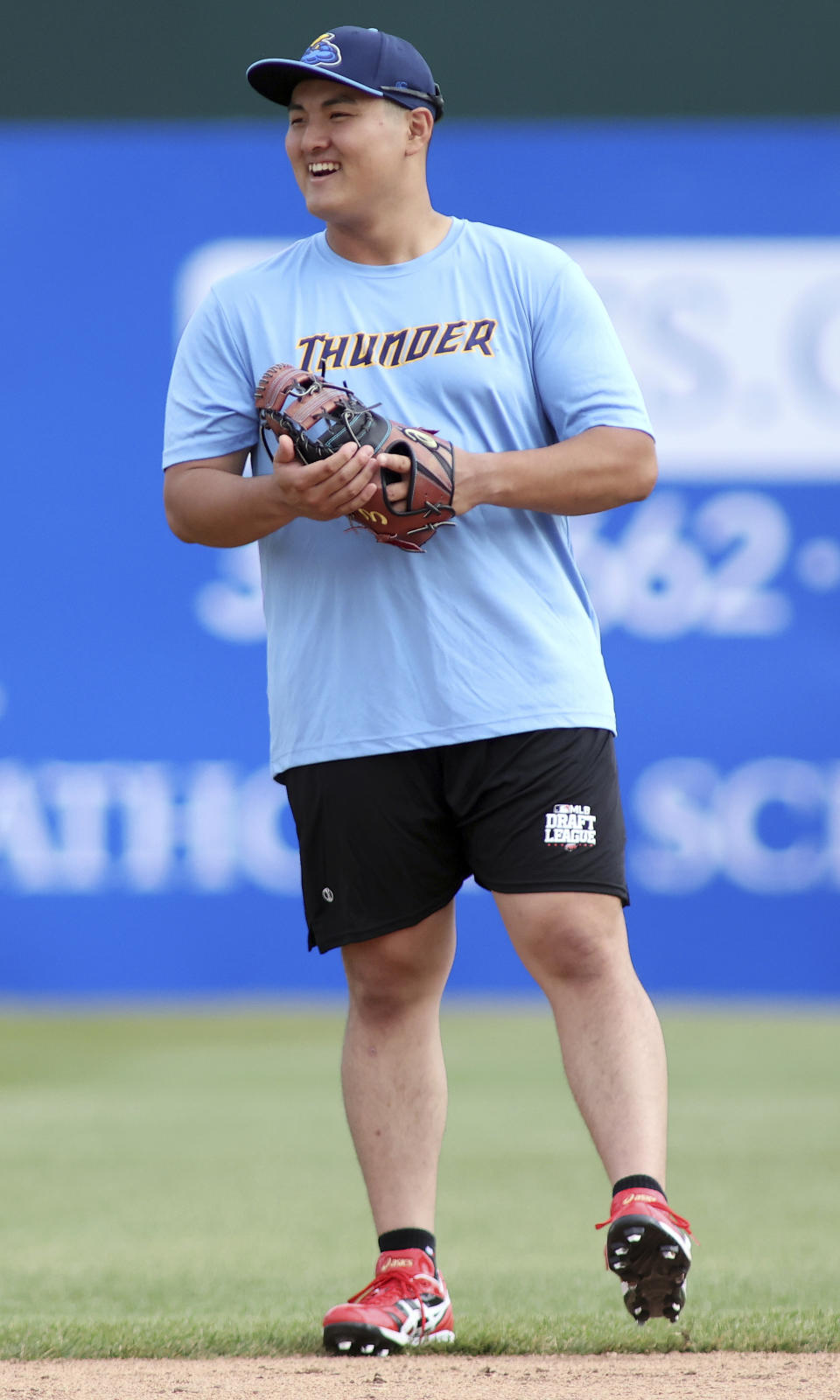 Trenton Thunder first baseman Rintaro Sasaki (49) laughs before a baseball game against the Frederick Keys, Tuesday, June 11, 2024 , in Frederick, Md. The 19-year-old prospect will make his U.S. debut Tuesday in the MLB Draft League, playing for the Trenton Thunder of New Jersey along with others hoping to one day develop into major leaguers.(AP Photo/Daniel Kucin Jr.)