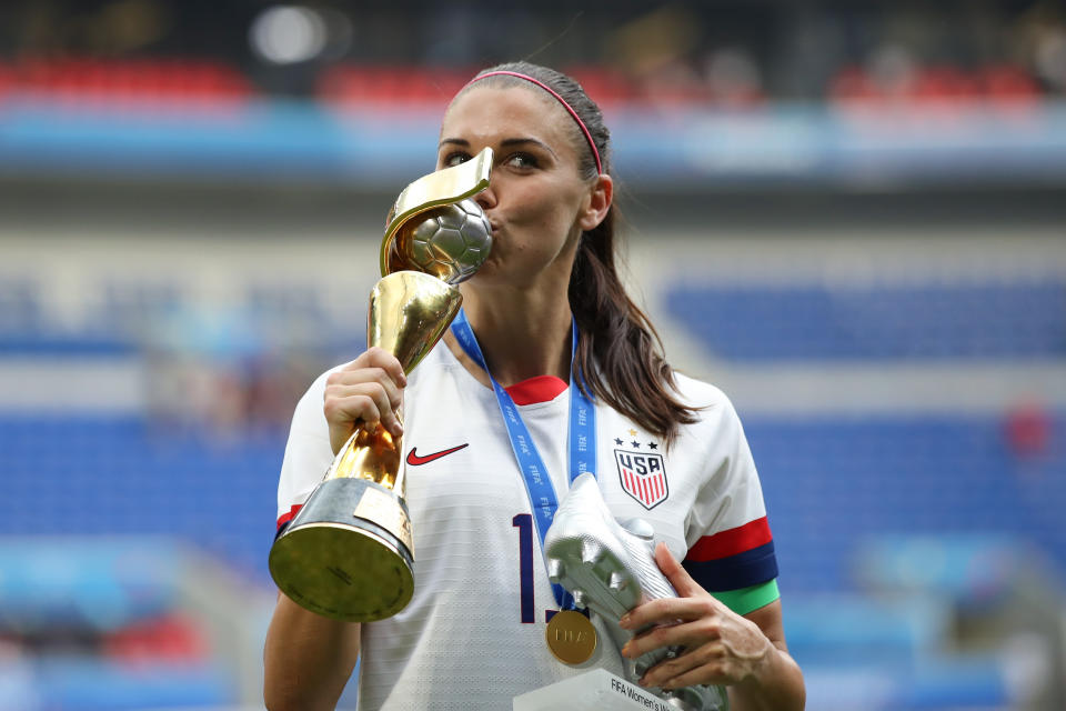 LYON, FRANCE - JULY 07: Alex Morgan of USA kisses the trophy during the 2019 FIFA Women's World Cup France Final match between The United States of America and The Netherlands at Stade de Lyon on July 7, 2019 in Lyon, France. (Photo by Marc Atkins/Getty Images)