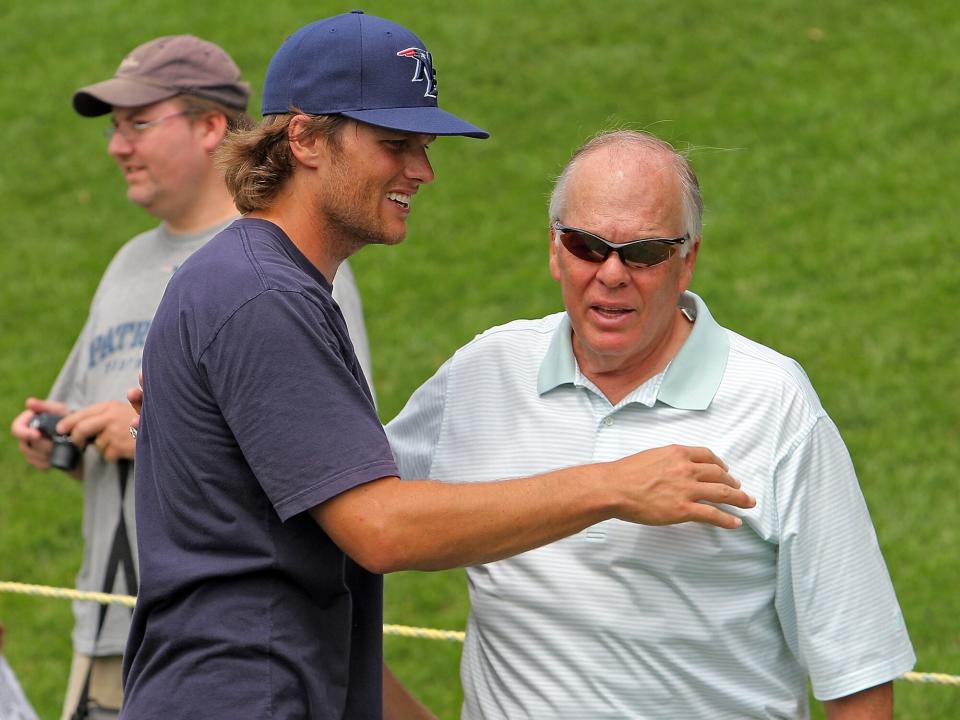 Tom Brady gets a birthday hug and kiss from his dad, Tom at the end of the New England Patriots Training Camp morning session at Gillette Stadium Tuesday, August 3, 2010. Staff Photo by Matt Stone