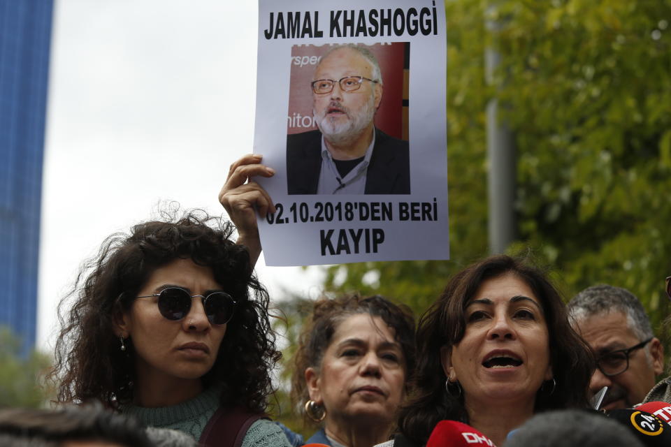 Activists, members of the Human Rights Association Istanbul branch, holding posters with photos of missing Saudi journalist Jamal Khashoggi, talk to members of the media, during a protest in his support near the Saudi Arabia consulate in Istanbul, Tuesday, Oct. 9, 2018. The poster reads in Turkish: ' Jamal Khashoggi, missing since October 2, 2018'. Khashoggi disappeared after entering Saudi Arabia's consulate to obtain paperwork required for his marriage to his Turkish fiancee. Turkish officials have alleged he was killed in the compound while Saudis officials said he left the building unharmed. (AP Photo/Lefteris Pitarakis)