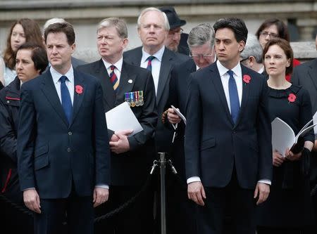 Britain's opposition Labour Party leader Ed Miliband (R) and his wife Justine stand next to Deputy Prime Minister Nick Clegg at the ceremony to mark the 100th anniversary of the start of the Gallipoli campaign, at the Cenotaph on Whitehall in London, April 25, 2015. REUTERS/Peter Nicholls