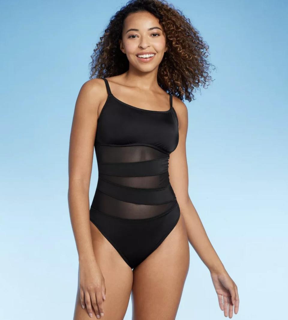 A black mesh one piece swimsuit
