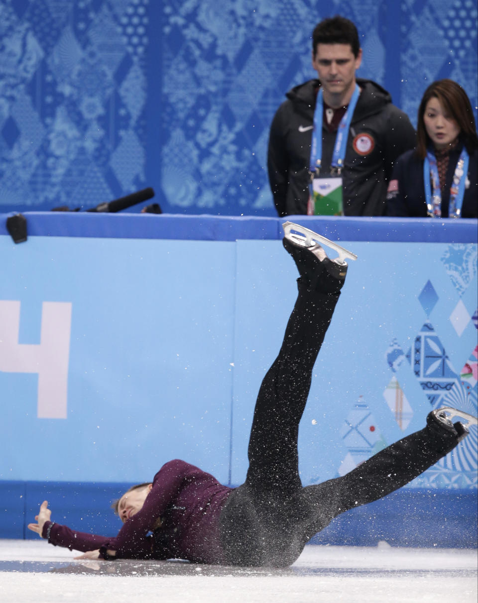 Jeremy Abbott of the United States falls as he competes in the men's short program figure skating competition at the Iceberg Skating Palace during the 2014 Winter Olympics, Thursday, Feb. 13, 2014, in Sochi, Russia. (AP Photo/Bernat Armangue)