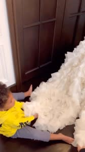 Cutest Helper Stormi Fluffs Mom Kylie Jenners Met Gala Dress