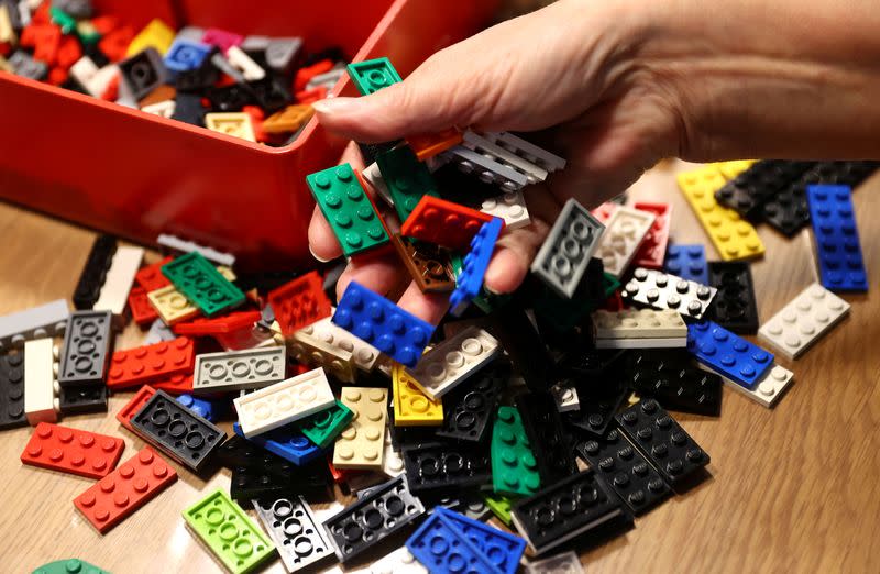 Rita Ebel, nicknamed "Lego grandma", builds a wheelchair ramp from donated Lego bricks in the living room of her flat in Hanau