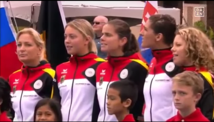 German players were shocked when an American soloist sang a long-outdated version of the national anthem.