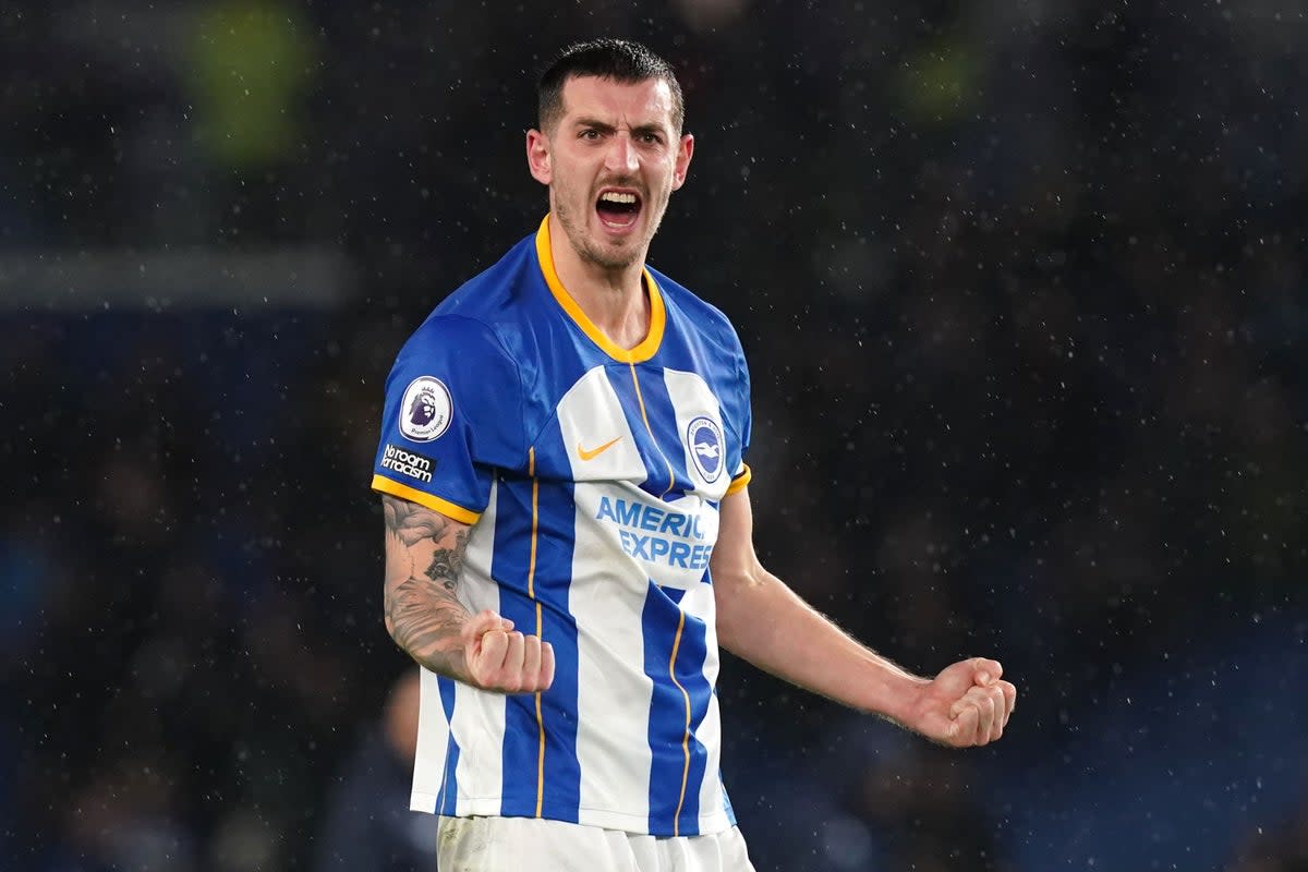 Lewis Dunk celebrates after Brighton reach FA Cup semi-finals with win over Grimsby  (PA Wire)