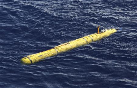 The Bluefin-21 Autonomous Underwater Vehicle sits in the water after being deployed from the Australian Defence Vessel Ocean Shield in the southern Indian Ocean during the continuing search for the missing Malaysian Airlines flight MH370 in this picture released by the Australian Defence Force April 17, 2014. REUTERS/Australian Defence Force/Handout via Reuters