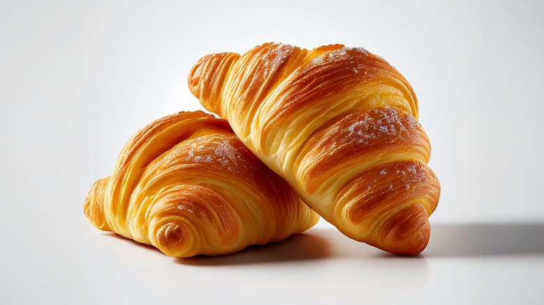 two croissants on white background