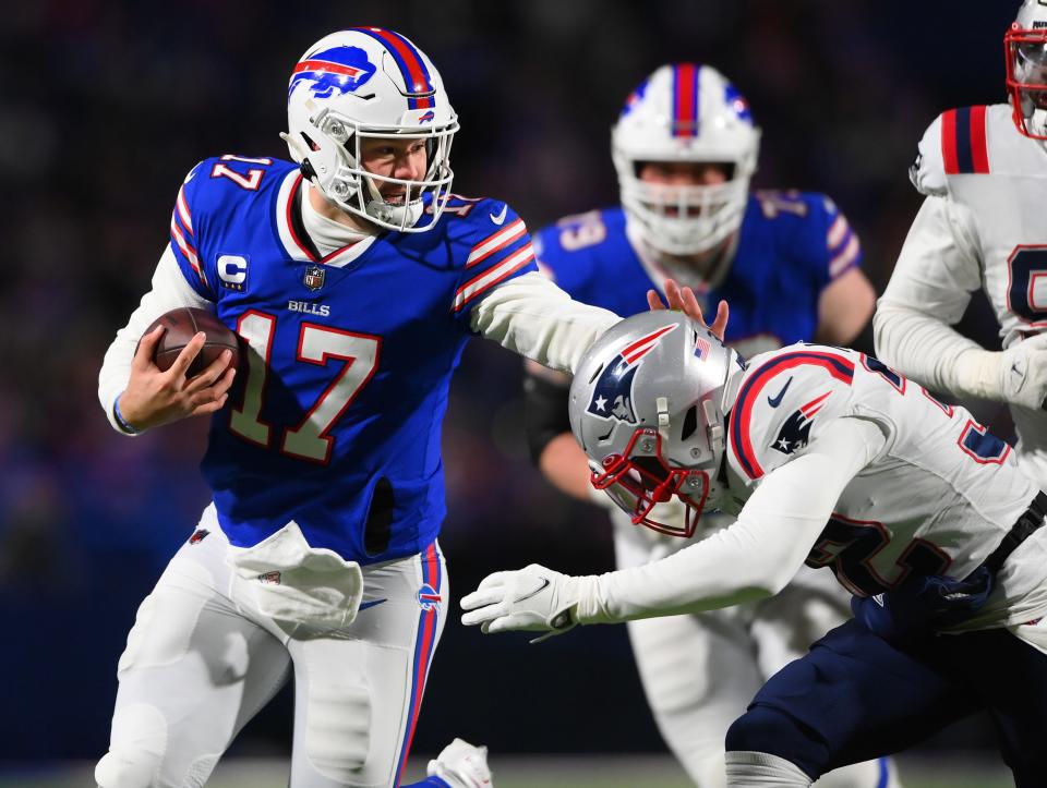 Buffalo Bills quarterback Josh Allen scrambles during the first quarter against the New England Patriots at Highmark Stadium.