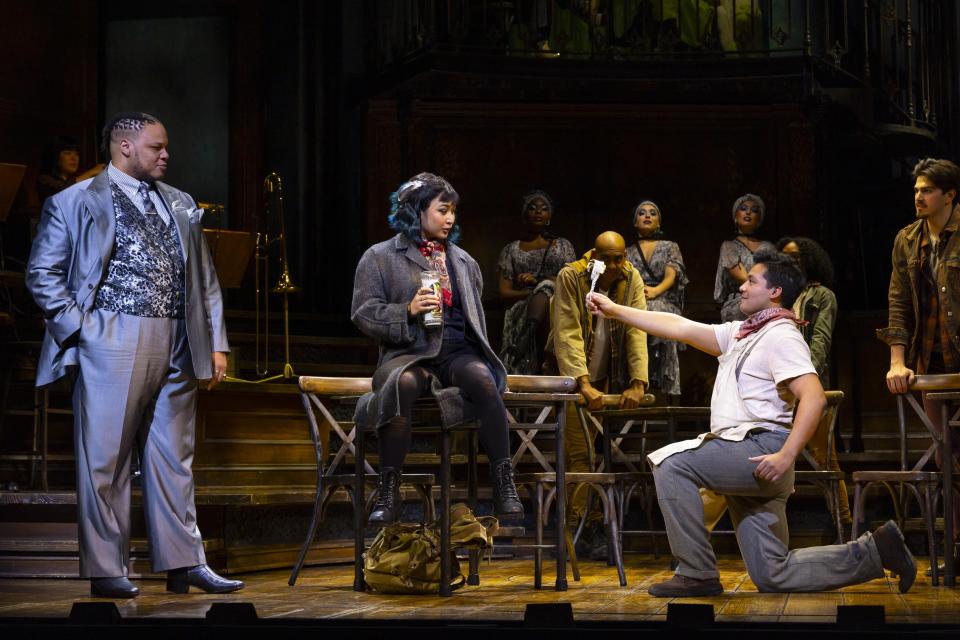 Will Mann, left, as Hermes, with Amaya Braganza as Euydice and J. Antonio Rodriguez as Orpheus in the touring production of “Hadestown” at the Van Wezel Performing Arts Hall.