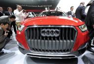 Members of the media get a close-up view of the Audi Q3 Vail during the first press preview day for the North American International Auto Show in Detroit, Michigan, U.S. on January 9, 2012. REUTERS/Mike Cassese/File Photo