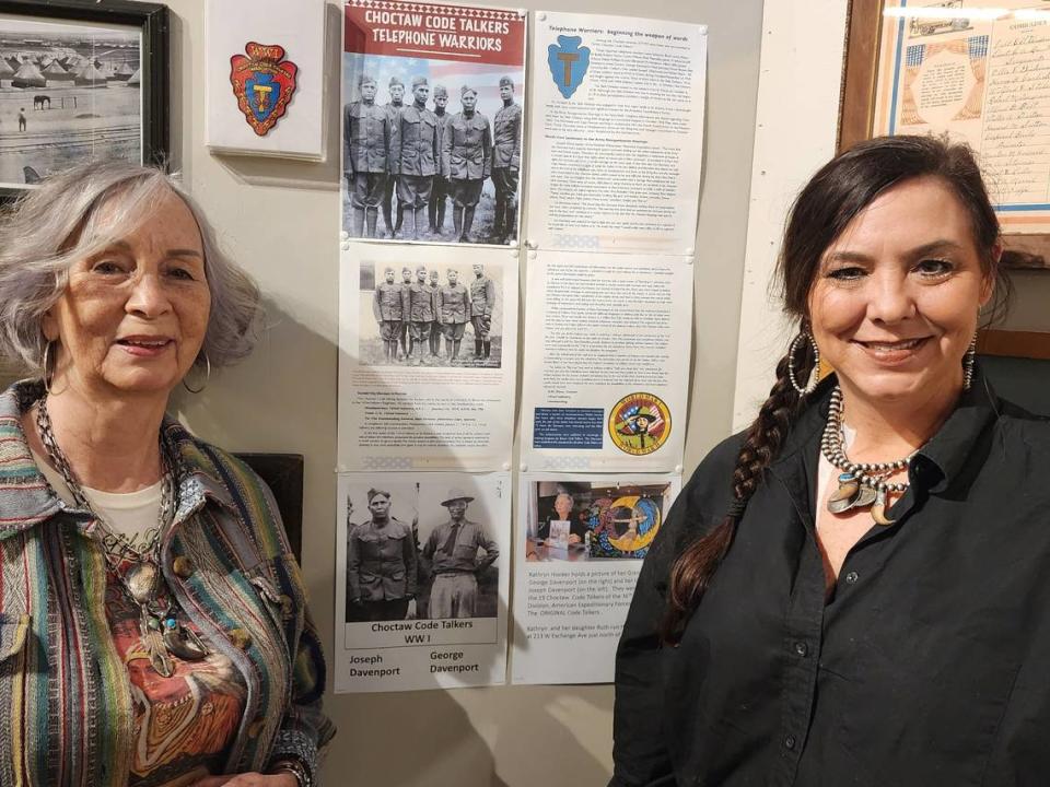 Kathryn Hooker (left) and her daughter, Ruth Hooker, next to the display honoring the original Choctaw code talkers in World War I. Among them were Kathryn’s grandfather (Ruth’s great grandfather) George Davenport and her uncle (Ruth’s great uncle) Joseph Davenport.