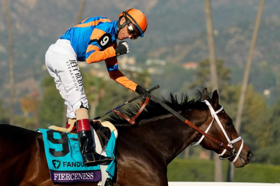 John Velazquez celebrates as he rides Fierceness after winning the Breeders’ Cup Juvenile horse race Friday, Nov. 3, 2023 at Santa Anita Park in Arcadia, Calif. (AP Photo/Ashley Landis)