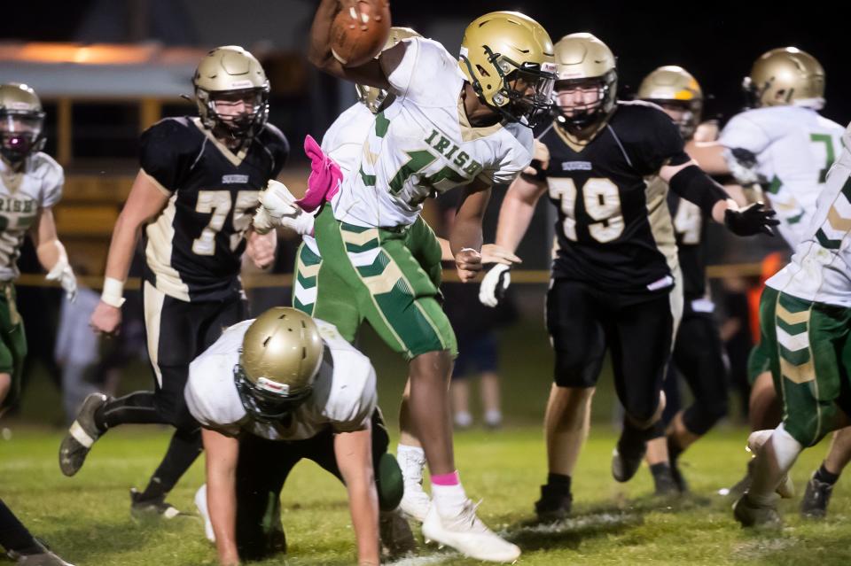 York Catholic quarterback LeVan McFadden stays on his feet as he runs the ball in the fourth quarter of a YAIAA Division III football game at J.T. Flaherty Field on Friday, Oct. 22, 2021, in McSherrystown.