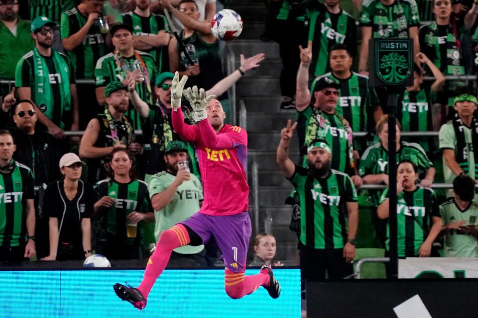 Austin FC goalkeeper Brad Stuver leaps to catch a ball during last Saturday's 1-0 win over CF Montreal at Q2 Stadium. It was the first of five matches over a 14-day period for El Tree, which opens CONCACAF play Tuesday.