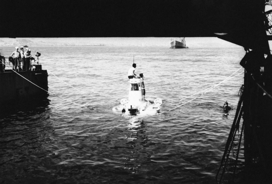 The submarine Alvin sits in the well deck of a U.S. Navy landing ship dock as the deck is flooded to set the Alvin afloat. The two-man sub was one of two miniature subs used to search and recover debris in the depths off the coast of Palomares on Feb. 24, 1966. (AP Photo)