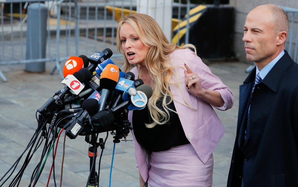 Stormy Daniels speaks to media along with lawyer Michael Avenatti outside federal court in the Manhattan on April 16. (Photo: Lucas Jackson/Reuters)