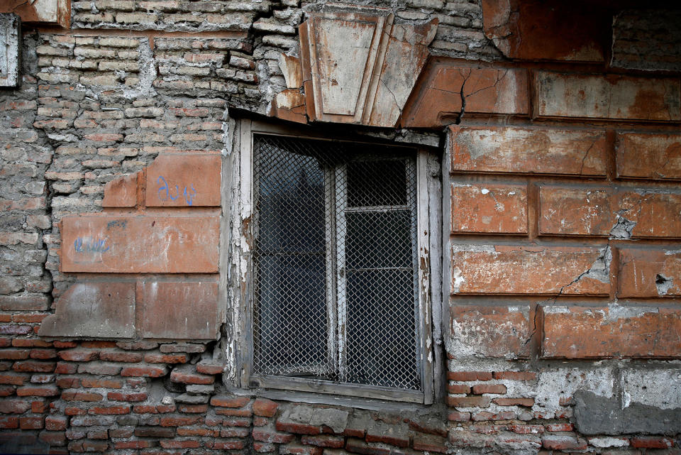 <p>A window of an abandoned part of an old house is seen in the old town, Tbilisi, Georgia, April 6, 2017. (Photo: David Mdzinarishvili/Reuters) </p>