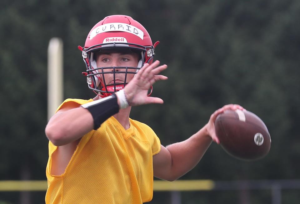 Archbishop Stepinac quarterback Will Currid passes during a drill on the first day of football practice for the CHSAA at at Archbishop Stepinac in White Plains Aug. 16, 2023.  