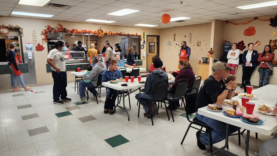 Volunteers and staff look over patrons of the Thanksgiving meal Thursday at the Salvation Army in downtown Amarillo.