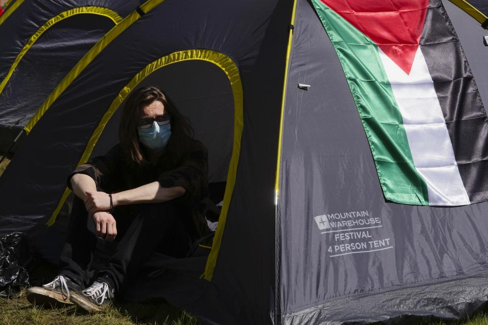 A pro-Palestinians student camps outside the Pitt Rivers Museum at Oxford, in England, Thursday, May 9, 2024. Students in the UK, including in Leeds, Newcastle and Bristol, have set up tents outside university buildings, replicating the nationwide campus demonstrations which began in the US last month. (AP Photo/Kin Cheung)