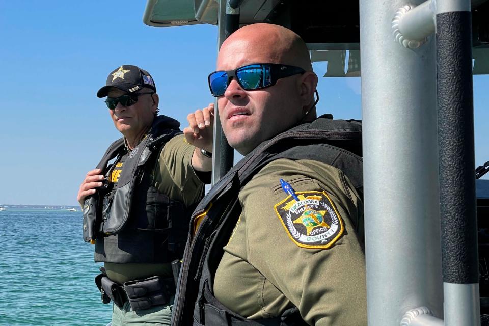 Okaloosa County Sheriff's Office Marine Unit deputies Michael Powell and Andrew Maltais keep an eye on boat traffic near Destin's Marler Bridge.  The Sheriff's Office arrested 17 people for boating under the influence over the Fourth of July weekend.