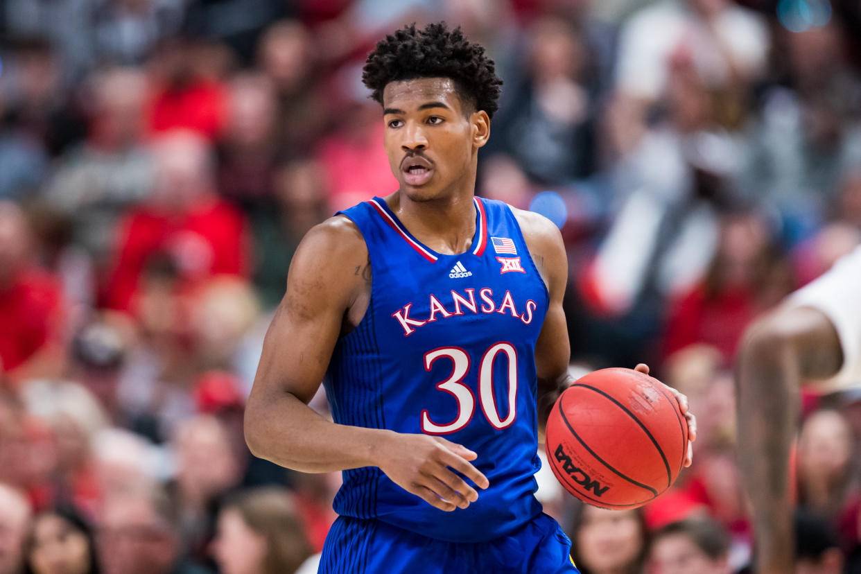 Kansas guard Ochai Agbaji handles the ball.