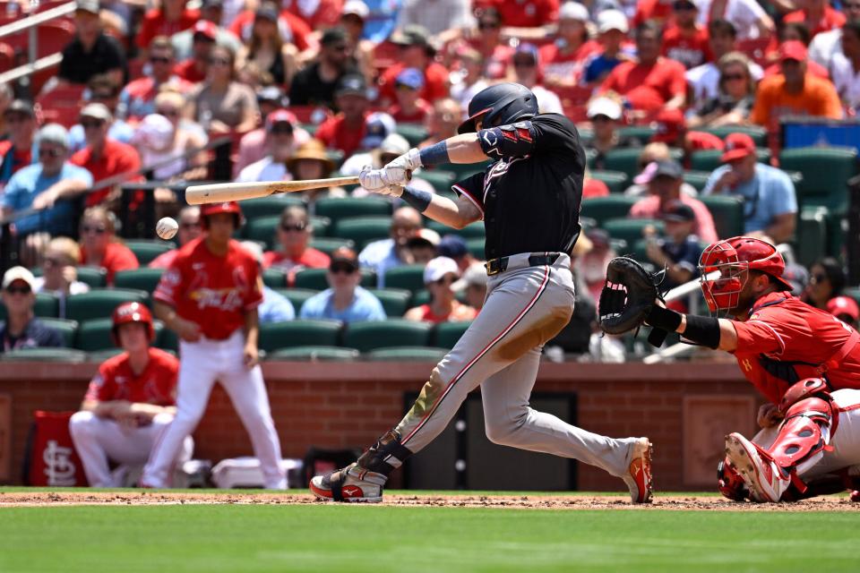 Washington Nationals right fielder Lane Thomas hits an RBI double against the St. Louis Cardinals during a game on Sunday. Thomas was traded to the Cleveland Guardians for three prospects,