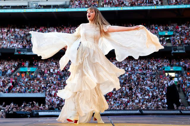 <p>Kevin Mazur/Getty </p> Taylor Swift performs in London