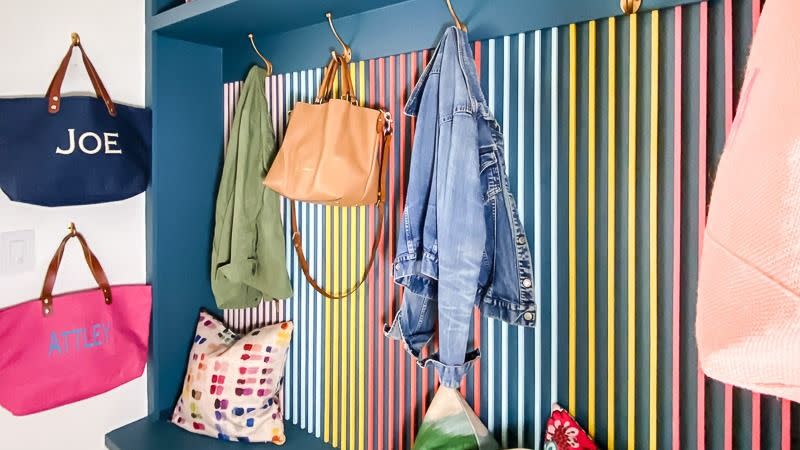 a blue shelf with clothes on it