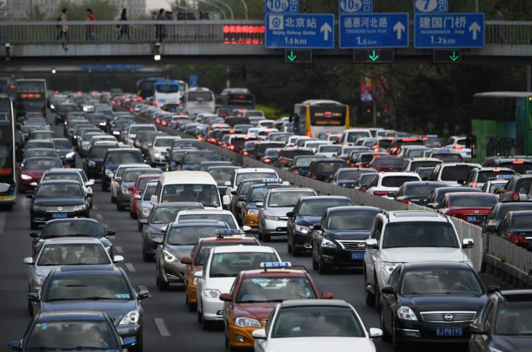 Traffic on Beijing's Second Ring Road on April 14, 2017. Manufacturers have reaped a windfall as the fast-expanding Chinese middle class hits the road, but clouds loom as top manufacturers pitch their latest models at the Shanghai auto show