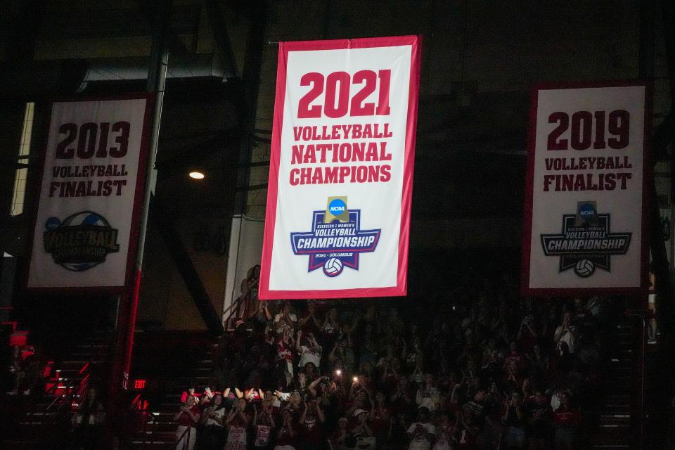 The Wisconsin Badgers unveil their 2021 NCAA volleyball championship banner at the UW Field House.