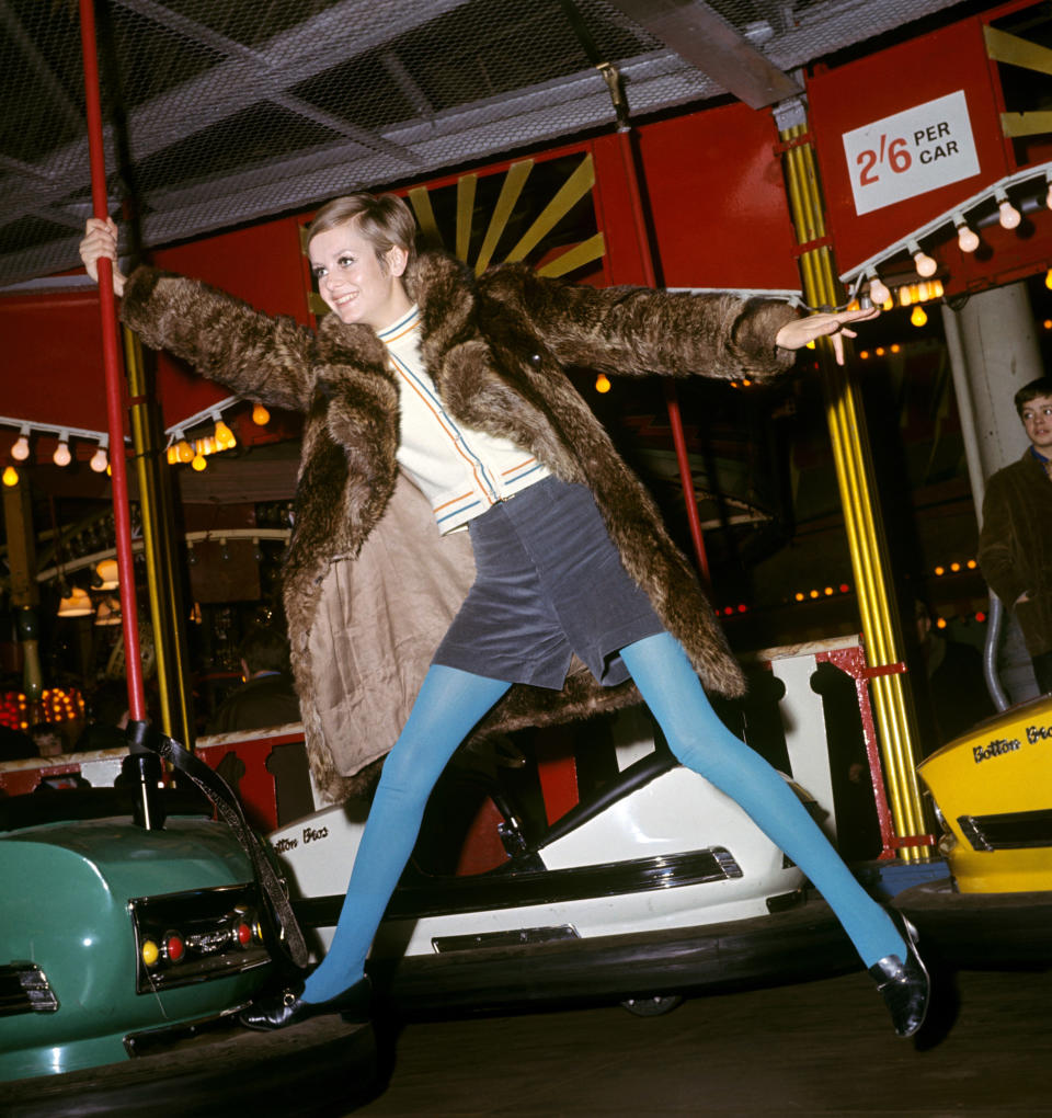 Twiggy poses with bumper cars at the Bertram Mills Circus.