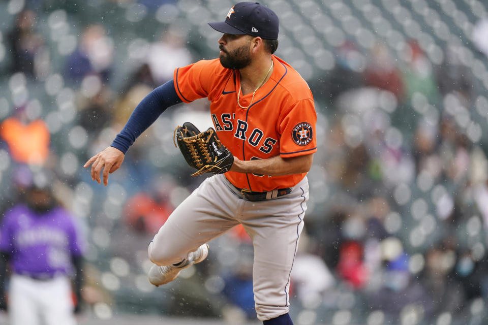 Houston Astros starting pitcher Jose Urquidy works against the Colorado Rockies in the third inning of a baseball game Wednesday, April 21, 2021, in Denver. (AP Photo/David Zalubowski)