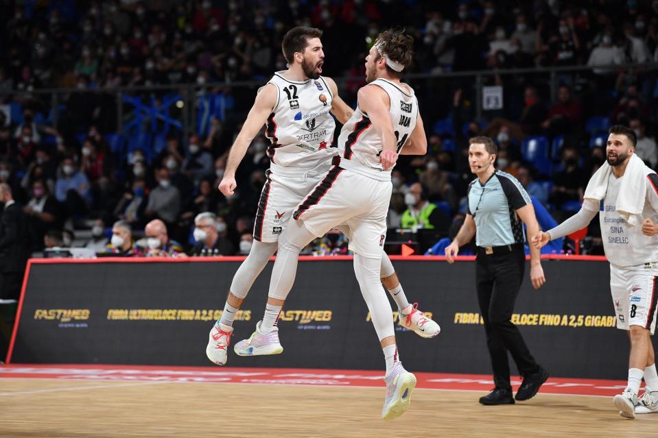 Mike Daum chest-bumps a teammate during a game in Italy last season.