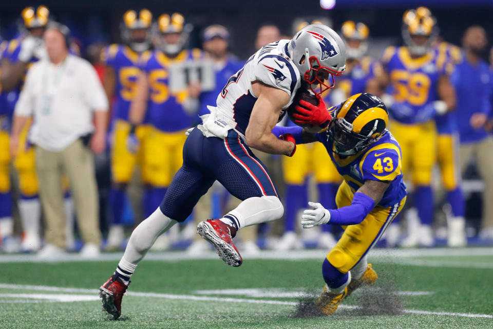 <p>John Johnson III #43 of the Los Angeles Rams tackles Julian Edelman #11 of the New England Patriots in the second half during Super Bowl LIII at Mercedes-Benz Stadium on February 3, 2019 in Atlanta, Georgia. (Photo by Kevin C. Cox/Getty Images </p>