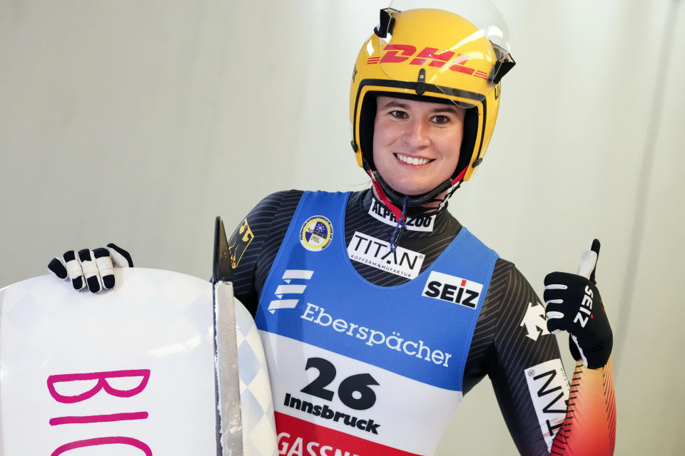 Natalie Geisenberger of Germany celebrates during the women's race at the Luge World Cup in Igls near Innsbruck, Austria, Sunday, Dec. 19, 2021. (AP Photo/Matthias Schrader)