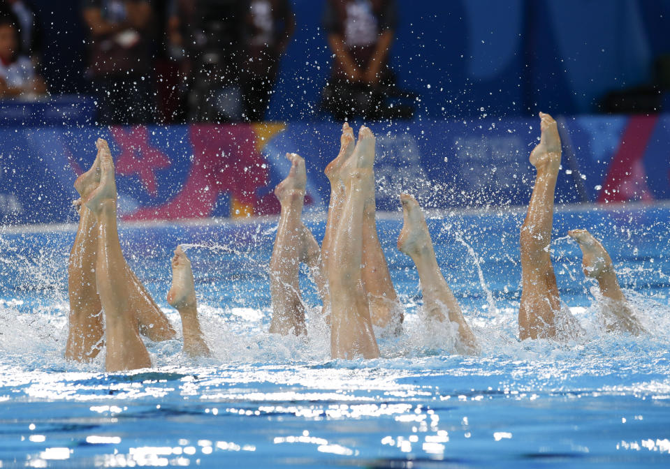 Members of Canada's artistic swimming team compete for the gold medal in the free routine event at the Pan American Games in Lima, Peru, Wednesday, July 31, 2019. (AP Photo/Moises Castillo)