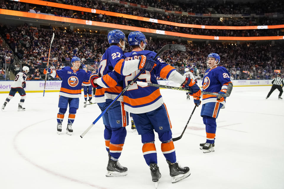 New York Islanders centerman Brock Nelson celebrates his goal with teammates during the second period of a NHL hockey game against Columbus Blue Jackets, Saturday, Nov. 12, 2022, in Elmont, N.Y. (AP Photo/Eduardo Munoz Alvarez)