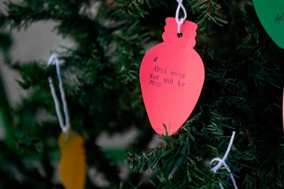 A note placed on on a Christmas tree during a candlelight vigil in honor of three Gautier High School graduates, Se’Dhari Saniya Watson-Person, Kyla “Muffin” Watkins, and Tatyanna Richmond, at Gautier High School in Gautier on Thursday, Dec. 7, 2023. The tree will be placed inside Gautier High School in memory of Watson-Person and Watkins, who were killed in the crash.