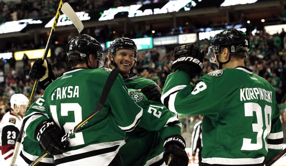 Dallas Stars’ Radek Faksa (12), Jamie Oleksiak (5) and Lauri Korpikoski (38) celebrate after Korpikoski scores against the Arizona Coyotes during the third period of an NHL hockey game, Friday, Feb. 24, 2017, in Dallas. (AP Photo/Mike Stone)