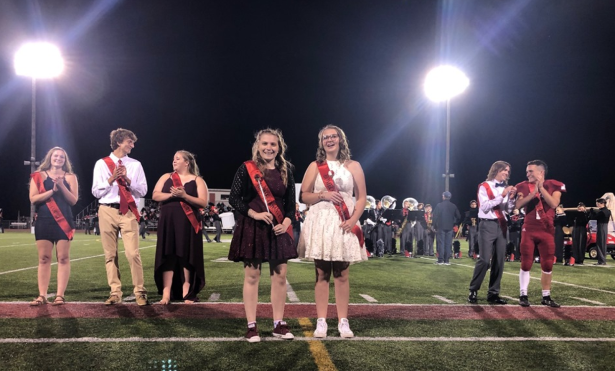 Milford High School's Homecoming Royalty, Abbey Stropes and Trinity Miller, received their scepters in front of their Homecoming Court on Friday. (Photo: Milford Schools via Facebook)