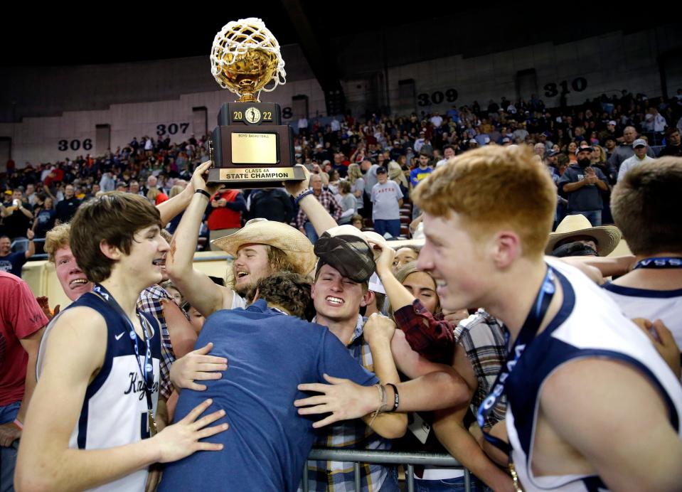 Kingfisher celebrates after beating Victory Christian in the Class 4A boys state basketball championship game Saturday at State Fair Arena.