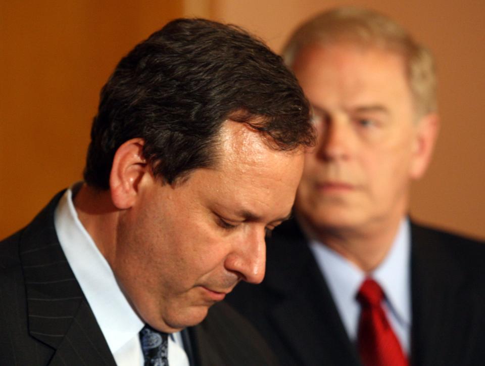 Democrat Marc Dann, left, during his resignation speech in the governor's office at the Ohio Statehouse in May 2008. Dann was the last Ohio Attorney General to step down. The Ohio Democratic Party is now calling on Republican Dave Yost to resign.