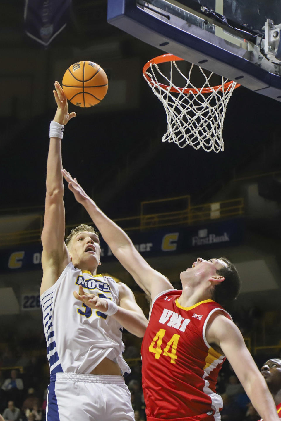 FILE -Chattanooga's Jake Stephens (33) shoots against Virginia Military Institute's Tyler Houser during an NCAA college basketball game Saturday, Jan. 7, 2023, in Chattanooga, Tenn. Stephens stands apart from other bigs on draft boards because he is an “unbelievable shooter” from 3-point range, according to Ryan Blake, director of scouting for the NBA. Stephens has made 42 3s this season on 41% shooting, and he also averages 2.35 blocks and 10.2 rebounds.(Olivia Ross/Chattanooga Times Free Press via AP, File)