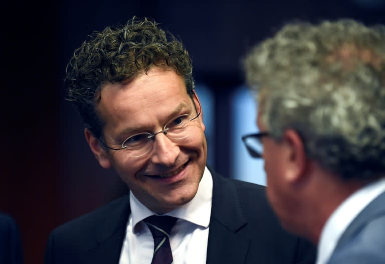Dutch Finance Minister and President of Eurogroup Jeroen Dijsselbloem (L) said Eurozone finance ministers had achieved a "major breakthrough" on a debt relief deal with Greece