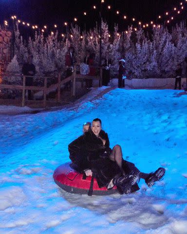 <p>Kourtney Kardashian/Instagram</p> Kourtney Kardashian Barker and Travis Barker at the annual Kardashian-Jenner Christmas Eve party