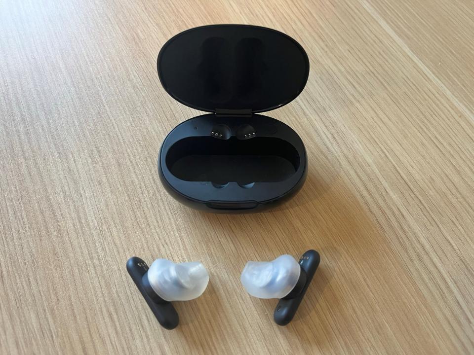 Ultimate Ears Fit Earbuds open laying on the table with the case