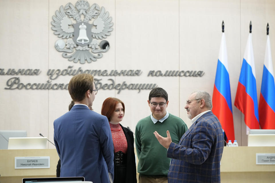 Boris Nadezhdin, a liberal Russian politician who is seeking to run in the March 17 presidential election, right, speaks with his election team members prior to a meeting of the Russia's Central Election Commission in Moscow, Russia, Thursday, Feb. 8, 2024. Russia's Central Election Commission holds a meeting where it decides whether an opposition presidential candidate Boris Nadezhdin is qualified to run in the March election. (AP Photo/Alexander Zemlianichenko)